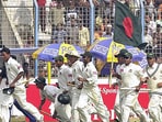 Bangladesh players take a lap of the ground after winning their first Test match by beating Zimbabwe in Chittagong. Bangladesh players take a lap of the ground after winning their first Test match by beating Zimbabwe in Chittagong.