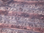 In an aerial view, destroyed homes are seen as the Palisades Fire continues to burn on January 09, 2025 in Pacific Palisades, California. In an aerial view, destroyed homes are seen as the Palisades Fire continues to burn on January 09, 2025 in Pacific Palisades, California.