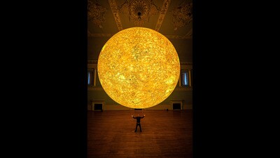Luke Jerram pictured during the unveiling of his latest astronomical sculpture, Helios, in the Ball Room at Bath Assembly Rooms (Ben Birchall/PA) Luke Jerram pictured during the unveiling of his latest astronomical sculpture, Helios, in the Ball Room at Bath Assembly Rooms (Ben Birchall/PA)