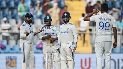 India's captain Rohit Sharma (L) and his teammates Sarfaraz Khan (2L) and Rishabh Pant (2R) look at their teammate Ravichandran Ashwin (AFP) India's captain Rohit Sharma (L) and his teammates Sarfaraz Khan (2L) and Rishabh Pant (2R) look at their teammate Ravichandran Ashwin (AFP)