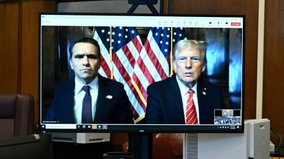 US President-elect Donald Trump and his attorney Todd Blanche are seen on a screen at Manhattan Criminal Court in New York, U.S., on January 10, 2025. (Reuters)