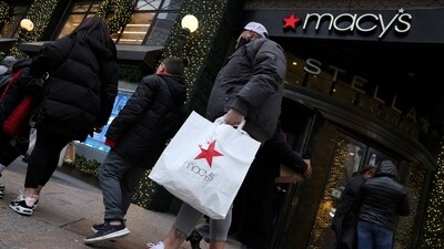FILE PHOTO: A customer exits the Macy's flagship department store in midtown Manhattan in New York City, U.S., December 11, 2023.  REUTERS/Brendan McDermid/File Photo (REUTERS)