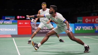 India's Satwiksairaj Rankireddy, front and Chirag Shetty in action during their men's doubles badminton quarterfinals match (AP)