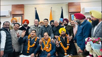 Newly elected mayor Kundan Gogoi (centre, garlanded) flanked by senior deputy mayor Harinder Singh Kohli (left) and deputy mayor Jagdeep Singh Jagga in Patiala on Friday. (HT Photo)