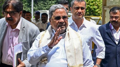 Karnataka Chief Minister Siddaramaiah with his legal advisor Ponnanna. (PTI) Karnataka Chief Minister Siddaramaiah with his legal advisor Ponnanna. (PTI)