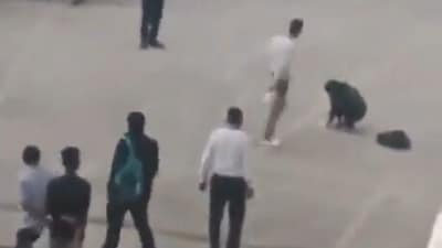 The blurry, one-minute video, which surfaced online on Thursday, shows the attacker calmly wielding the cleaver before his colleague. (Screen grab from viral video) (X) The blurry, one-minute video, which surfaced online on Thursday, shows the attacker calmly wielding the cleaver before his colleague. (Screen grab from viral video) (X)