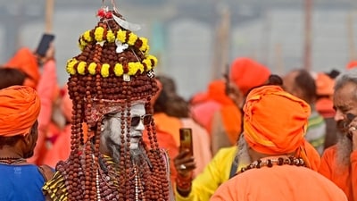Sadhus arrive to raise Dharam Dhwaja (religious flag) ahead of the Maha Kumbh Mela festival in Prayagraj. (AFP)