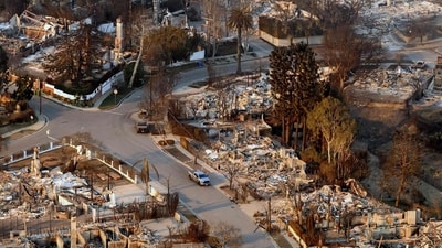In this aerial view taken from a helicopter, burned homes are seen from above during the Palisades fire in the Pacific Palisades neighborhood of Los Angeles. (Josh Edelson/AFP) In this aerial view taken from a helicopter, burned homes are seen from above during the Palisades fire in the Pacific Palisades neighborhood of Los Angeles. (Josh Edelson/AFP)