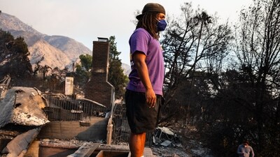 A young man gazes out over the devastation from his family's home destroyed in the Eaton Fire in Altadena, California. Another rapidly expanding fire, the Kenneth Fire, erupted Thursday near Calabasas—home to affluent neighbourhoods and celebrities—spreading to 960 acres (388 hectares) within hours. (AFP) A young man gazes out over the devastation from his family's home destroyed in the Eaton Fire in Altadena, California. Another rapidly expanding fire, the Kenneth Fire, erupted Thursday near Calabasas—home to affluent neighbourhoods and celebrities—spreading to 960 acres (388 hectares) within hours. (AFP)