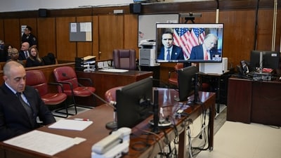 Todd Blanche, attorney for former US President Donald Trump, and US President-elect Donald Trump are seen on the screen at Manhattan criminal court in New York. (Reuters)