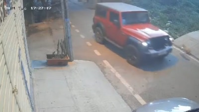 Mahindra Thar is seen running over the dog, sparking outrage. Mahindra Thar is seen running over the dog, sparking outrage.