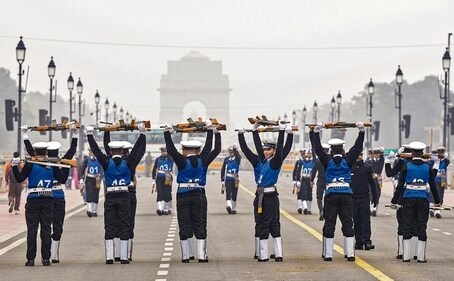 Flexing it right: Indian Navy personnel warm up in front of the India Gate. (Photo: Shahbaz Khan/PTI) Flexing it right: Indian Navy personnel warm up in front of the India Gate. (Photo: Shahbaz Khan/PTI)