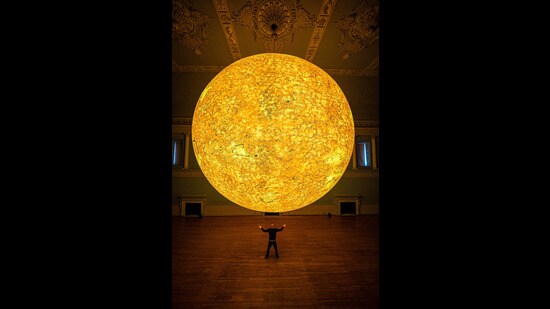 Luke Jerram pictured during the unveiling of his latest astronomical sculpture, Helios, in the Ball Room at Bath Assembly Rooms (Ben Birchall/PA)