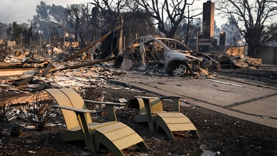Melted lawn chairs are seen near the remains of a burnt home after the passage of the Palisades Fire in Pacific Palisades, California.(Agustin Paullier/AFP)