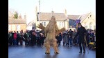 The Straw Bear is paraded through the streets accompanied by attendant keepers, musicians and dancers during the Whittlesea Straw Bear Festival in Whittlesea, Cambridgeshire (Joe Giddens/PA)