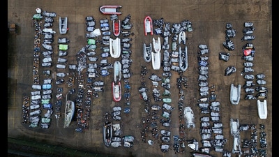 Confiscated small boats and outboard motors used to cross the Channel from France at a warehouse facility in Dover (Gareth Fuller/PA) Confiscated small boats and outboard motors used to cross the Channel from France at a warehouse facility in Dover (Gareth Fuller/PA)