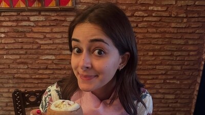 Ananya Panday also shared a photo of herself holding a kullad (clay pot) as she sat at a restaurant feasting on her meal. Ananya Panday also shared a photo of herself holding a kullad (clay pot) as she sat at a restaurant feasting on her meal.