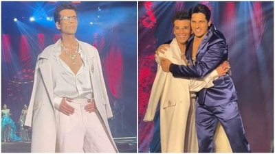 Karan Johar and Sidharth Malhotra walk the ramp at a fashion event. Karan Johar and Sidharth Malhotra walk the ramp at a fashion event.