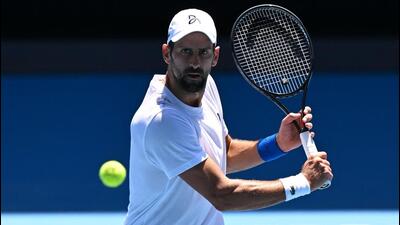 Novak Djokovic hits a return during a practice session ahead of the Australian Open, in Melbourne on Saturday. (AFP) Novak Djokovic hits a return during a practice session ahead of the Australian Open, in Melbourne on Saturday. (AFP)