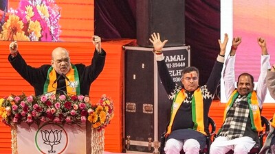 Union home minister Amit Shah addresses at the 'Jhuggi Basti Pradhan Sammelan', in New Delhi. (PTI) Union home minister Amit Shah addresses at the 'Jhuggi Basti Pradhan Sammelan', in New Delhi. (PTI)