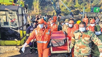 Rescue personnel carry the body of a worker recovered from an Assam mine on Saturday. (PTI) Rescue personnel carry the body of a worker recovered from an Assam mine on Saturday. (PTI)