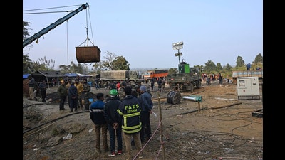 Rescue workers and others stand near a coal mine where at least nine miners became trapped on Monday, in Umrangso area of Dimapur Hasao district in northeastern state of Assam. (AP PHOTO) Rescue workers and others stand near a coal mine where at least nine miners became trapped on Monday, in Umrangso area of Dimapur Hasao district in northeastern state of Assam. (AP PHOTO)