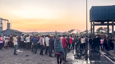 People gather at the site after a silo at a smelting plant collapsed in Chhattisgarh's Mungeli district on Thursday. (PTI Photo)