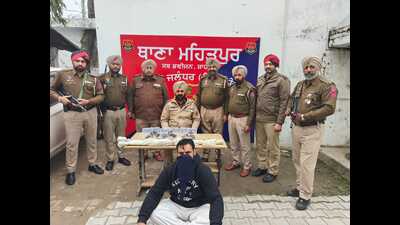 The accused in police custody.