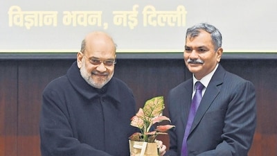 Union home minister Amit Shah being presented with a plant by Director General of the Narcotics Control Bureau (NCB) Anurag Garg during the Regional Conference on "Drug Trafficking and National Security", at Vigyan Bhawan in New Delhi on Saturday. (ANI)