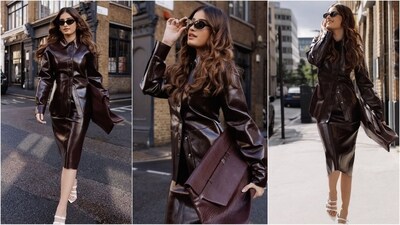 Rasha Thadani looks stunning in a sleek brown leather dress, paired with a chic bag, white strappy heels, and black shades, channeling runway model energy. (Instagram)