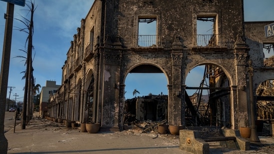 The charred remains of a restaurant occupies a corner of Sunset Boulevard following the Palisades Fire in the Pacific Palisades area of Los Angeles, California, US, on Friday, Jan. 10, 2025.(Bloomberg)