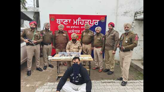 The accused in police custody.