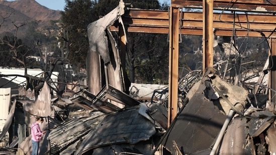 Pacific Palisades Fire: A congregant looks through the remains of Community United Methodist Church, which was destroyed by the Palisades Fire, as wildfires cause damage and loss through Los Angeles County on January 10, 2025 in Pacific Palisades, California.&nbsp;(Mario Tama/Getty Images/AFP)