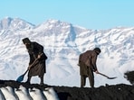 Afghan labourers shovel coal onto a truck bound for Pakistan, at a coal yard near snow-laden mountains on the outskirts of Kabul on January 6. (AFP) Afghan labourers shovel coal onto a truck bound for Pakistan, at a coal yard near snow-laden mountains on the outskirts of Kabul on January 6. (AFP)