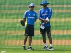 India's head coach Gautam Gambhir (L) and Abhishek Nayar look on during a practice session E India's head coach Gautam Gambhir (L) and Abhishek Nayar look on during a practice session E
