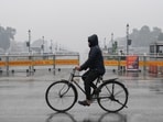 New Delhi, Jan 11 (ANI): A man passes on a bicycle at the Kartavya Path as drizzle lashes, in New Delhi on Saturday. (ANI Photo/Ishant) New Delhi, Jan 11 (ANI): A man passes on a bicycle at the Kartavya Path as drizzle lashes, in New Delhi on Saturday. (ANI Photo/Ishant)
