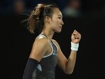 China's Zheng Qinwen reacts on winning the first set after a tie-break. China's Zheng Qinwen reacts on winning the first set after a tie-break.