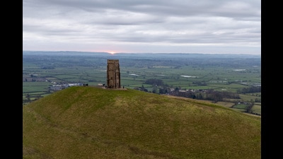 People watch the sun rise on Glastonbury Tor over the Somerset levels (Ben Birchall/PA) People watch the sun rise on Glastonbury Tor over the Somerset levels (Ben Birchall/PA)