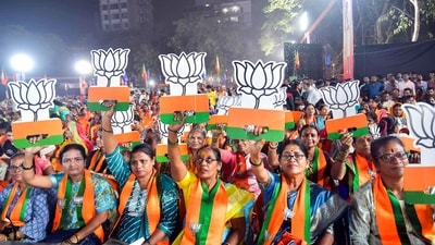 BJP women supporters brandishing the party logo during Union Home Minister Amit Shah's public meeting for the Maharashtra Assembly elections at Ghatkopar in Mumbai. (ANI FILE Photo) BJP women supporters brandishing the party logo during Union Home Minister Amit Shah's public meeting for the Maharashtra Assembly elections at Ghatkopar in Mumbai. (ANI FILE Photo)