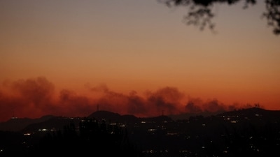 Smoke from the Palisades Fire rises above Altadena, California, U.S. As of Saturday evening, Cal Fire reported that the Palisades, Eaton, Kenneth, and Hurst fires had burned 62 square miles, an area larger than San Francisco. The Palisades and Eaton fires accounted for 59 square miles, with the Palisades Fire at 11% containment and the Eaton Fire at 15%, signaling continued efforts. (REUTERS)