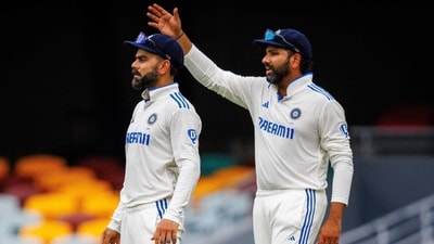 India's Rohit Sharma (R) gestures next to Virat Kohli during day five of the third cricket Test match between Australia and India at The Gabba in Brisbane on December 18 (AFP) India's Rohit Sharma (R) gestures next to Virat Kohli during day five of the third cricket Test match between Australia and India at The Gabba in Brisbane on December 18 (AFP)