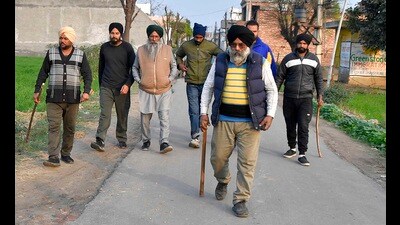 Hasanpur village residents out to catch stray dogs in Ludhiana on Sunday. (Manish/HT) Hasanpur village residents out to catch stray dogs in Ludhiana on Sunday. (Manish/HT)