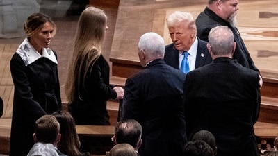 Mike Pence, second left, greets Melania Trump, left, as her husband President-elect Donald Trump, right, looks on at a state funeral for former President Jimmy Carter at the National Cathedral, Thursday, Jan. 9, 2025, in Washington. (Haiyun Jiang/The New York Times via AP, Pool) (AP) Mike Pence, second left, greets Melania Trump, left, as her husband President-elect Donald Trump, right, looks on at a state funeral for former President Jimmy Carter at the National Cathedral, Thursday, Jan. 9, 2025, in Washington. (Haiyun Jiang/The New York Times via AP, Pool) (AP)