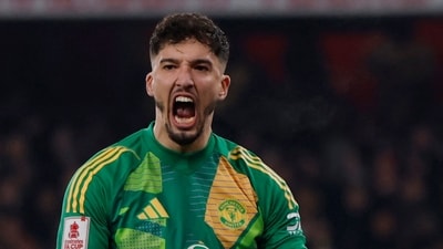 Manchester United's Altay Bayindir celebrates after he saves a penalty from Arsenal's Kai Havertz during the shoot-out (Action Images via Reuters)