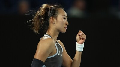 China's Zheng Qinwen reacts on winning the first set after a tie-break. (AFP)