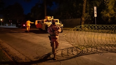 A National Guard officer enforces a curfew from 6:00 pm to 6:00 am in evacuation zones and areas under evacuation warnings in Santa Monica, California, on January 11, 2025, as wildfires cause widespread damage across the Los Angeles region. (Getty Images via AFP) A National Guard officer enforces a curfew from 6:00 pm to 6:00 am in evacuation zones and areas under evacuation warnings in Santa Monica, California, on January 11, 2025, as wildfires cause widespread damage across the Los Angeles region. (Getty Images via AFP)