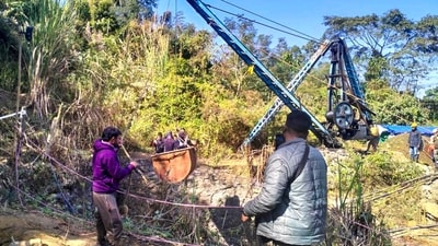 Rescue operation underway for labourers trapped inside a coal mine at Umrangso area, in Dima Hasao district, Assam, Saturday, Jan. 11, 2025. The body of another worker, who was trapped in the coal mine, was recovered on Saturday from the quarry during rescue operations, an official said. (PTI) Rescue operation underway for labourers trapped inside a coal mine at Umrangso area, in Dima Hasao district, Assam, Saturday, Jan. 11, 2025. The body of another worker, who was trapped in the coal mine, was recovered on Saturday from the quarry during rescue operations, an official said. (PTI)