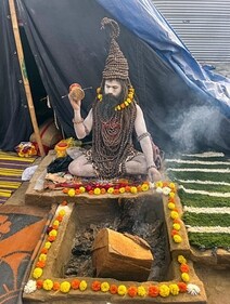 Panchayati Niranjani Akhara's Digambar Ajay Giri also known as Rudraksh Baba, who wears 11 thousand Rudraksh at his camp ahead of Maha Kumbh 2025, in Prayagraj on Saturday. (ANI) Panchayati Niranjani Akhara's Digambar Ajay Giri also known as Rudraksh Baba, who wears 11 thousand Rudraksh at his camp ahead of Maha Kumbh 2025, in Prayagraj on Saturday. (ANI)
