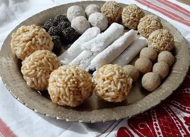 A plate of 'larus' and 'pithas' which are traditional Assamese sweets prepared for Magh Bihu. (HT PHOTO).