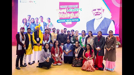 Prime Minister Narendra Modi in a group picture during the Viksit Bharat Young Leaders Dialogue 2025 on the occasion of National Youth Day, commemorating the birth anniversary of Swami Vivekananda, at Bharat Mandapam in New Delhi on Sunday. (ANI PHOTO)